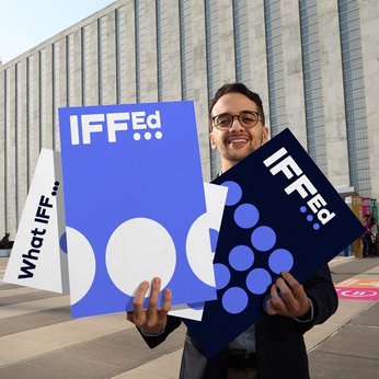 07 Man Holding Posters